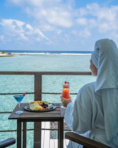 Guest Enjoying In-Room Dining at Holiday Inn Resort Maldives